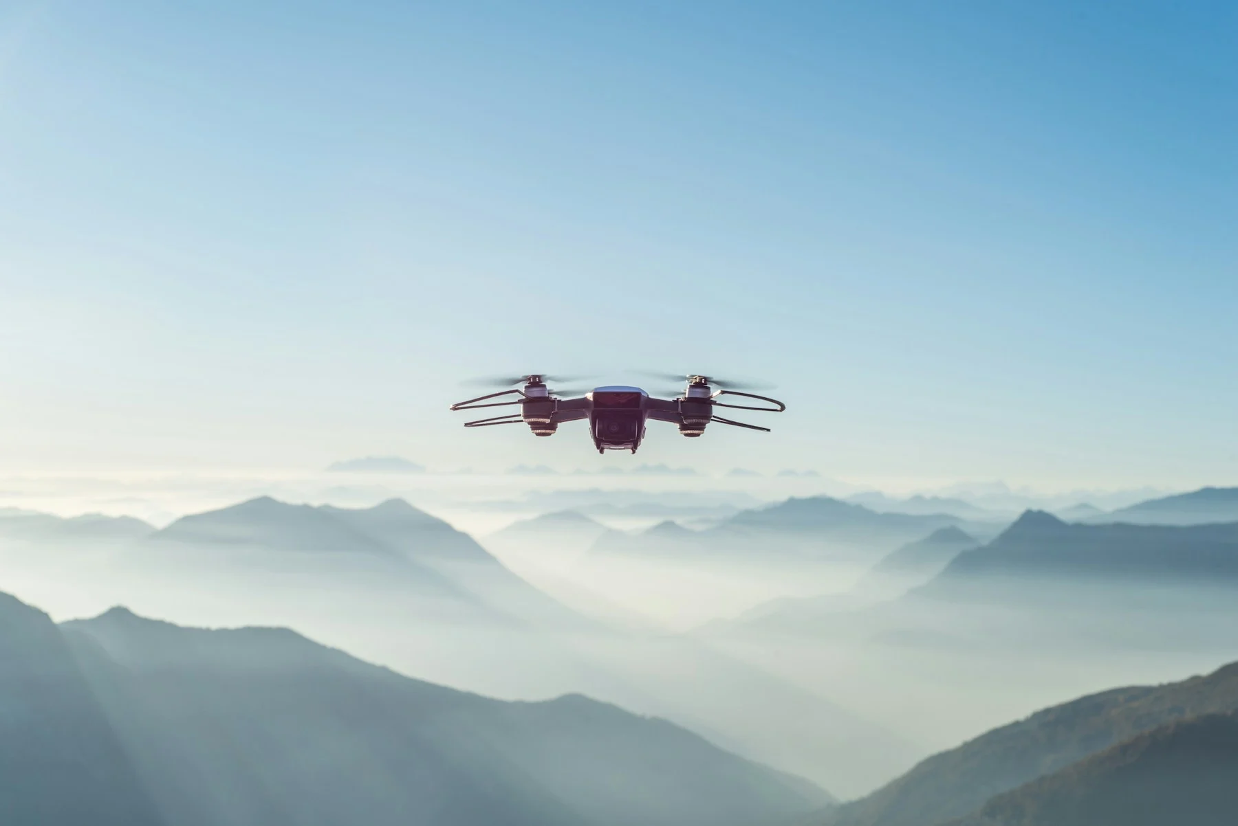 Drone flying above a mountain landscape