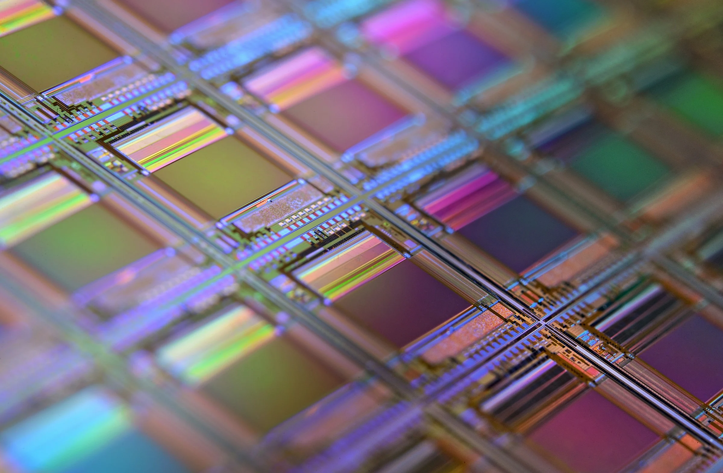 Macro view of an iridescent silicon microchip grid
